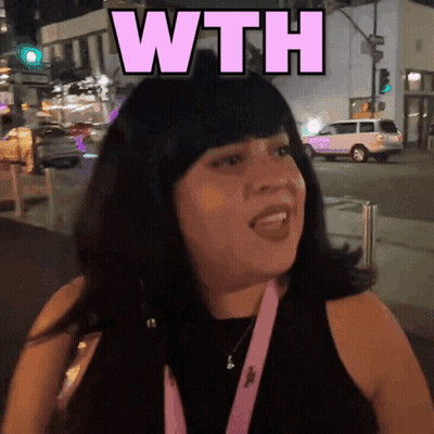 A Woman In A Black Tank Top With A Pink Lanyard Around Her Neck Says " Wth " GIF