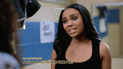 A Woman In A Black Tank Top With The Name Adam Giaudrone On The Bottom Right GIF