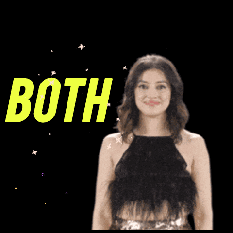 A Woman In A Black Top Is Smiling In Front Of A Sign That Says Good Luck Both GIF