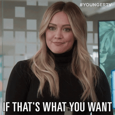 A Woman In A Black Turtleneck Is Smiling And Says " If That 'S What You Want " GIF