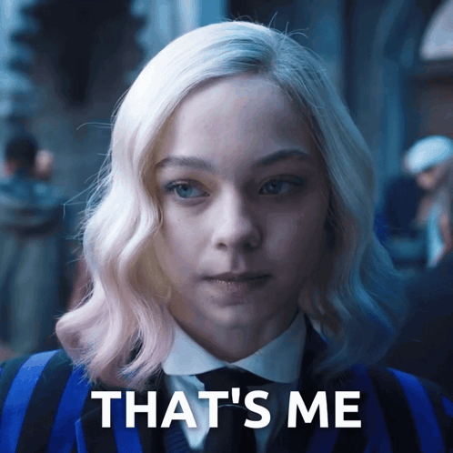 A Woman In A Blue And Black Suit With The Words That 'S Me On The Bottom GIF