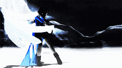 A Woman In A Blue And White Dress Is Dancing In The Dark GIF