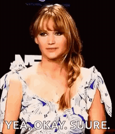 A Woman In A Blue And White Dress Is Making A Funny Face And Saying `` Yea Okay Sure . '' GIF