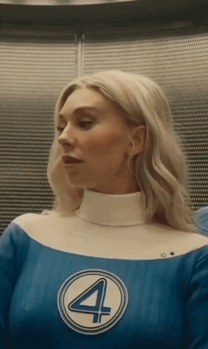 A Woman In A Blue And White Superhero Costume With The Number 4 On It . GIF
