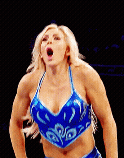 A Woman In A Blue Crop Top Is Making A Face GIF