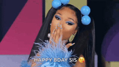 A Woman In A Blue Dress Is Blowing A Kiss And Saying Happy Birthday Sis . GIF