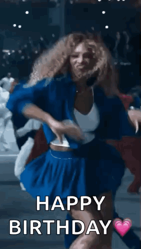 A Woman In A Blue Dress Is Dancing With The Words `` Happy Birthday '' . GIF