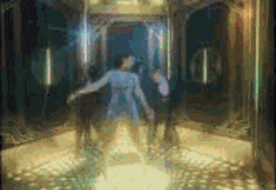 A Woman In A Blue Dress Is Standing In An Elevator With A Man In A Wheelchair Behind Her . GIF
