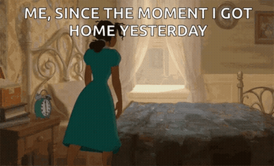 A Woman In A Blue Dress Is Standing In Front Of A Bed With The Words Me Since The Moment I Got Home Yesterday GIF