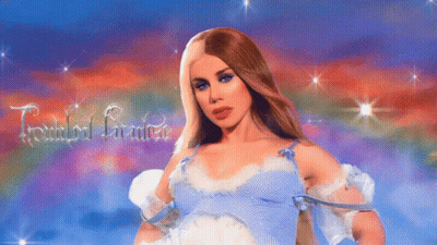 A Woman In A Blue Dress Is Standing In Front Of A Sign That Says Female Genius GIF