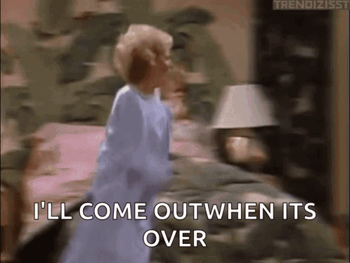 A Woman In A Blue Dress Is Standing On A Bed And Says I 'Ll Come Out When It 'S Over GIF