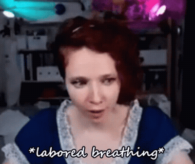 A Woman In A Blue Dress Is Talking About Labored Breathing . GIF