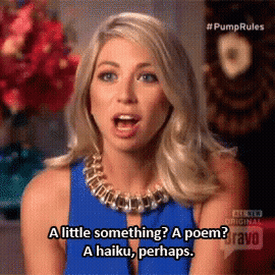 A Woman In A Blue Dress Says A Haiku Perhaps GIF