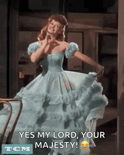 A Woman In A Blue Dress Says Yes My Lord Your Majesty Tcm GIF