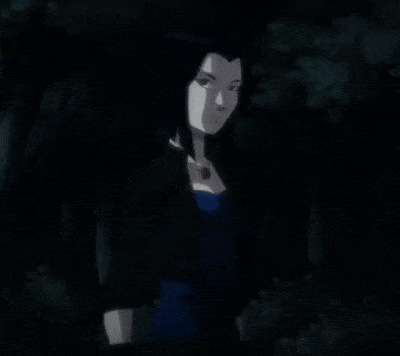 A Woman In A Blue Dress Stands Next To A Monster With Red Eyes GIF