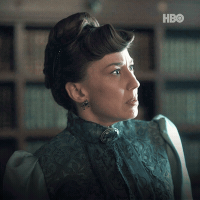 A Woman In A Blue Dress With A Hbo Logo On The Bottom GIF