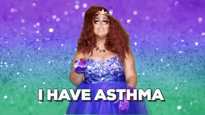 A Woman In A Blue Dress With A Tiara On Her Head Says I Have Asthma . GIF