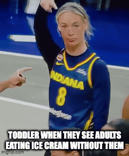 A Woman In A Blue Indiana Jersey Is Pointing At A Child GIF