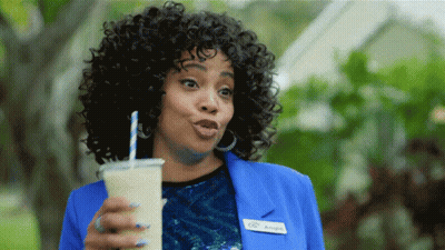 A Woman In A Blue Jacket Has A Name Tag That Says Angie GIF