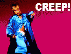A Woman In A Blue Jacket Is Dancing In Front Of A Pink Background That Says Creep On It GIF