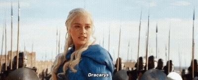 A Woman In A Blue Jacket Is Standing In Front Of A Crowd Of Soldiers And Says `` Dracarys '' . GIF