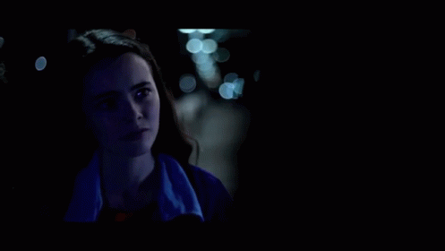 A Woman In A Blue Jacket Is Talking To Another Woman In A Dark Room And Says `` Did You Ever Love Me '' . GIF