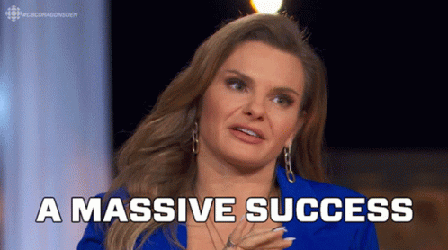 A Woman In A Blue Jacket Says " A Massive Success " In White Letters GIF