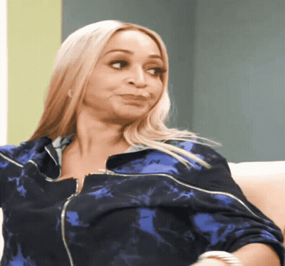 A Woman In A Blue Jacket With The Letter M On The Front GIF