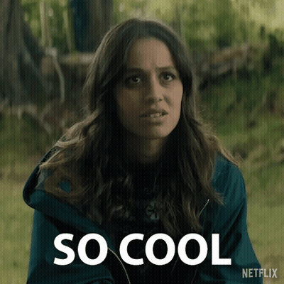 A Woman In A Blue Jacket With The Word So Cool Written On It GIF