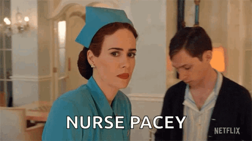 A Woman In A Blue Nurse 'S Uniform Is Standing Next To A Man And Says Nurse Pacey GIF
