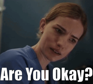 A Woman In A Blue Scrub Is Asking If She Is Ok GIF