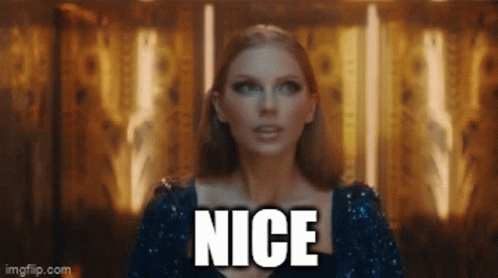 A Woman In A Blue Sequined Dress Says The Word Nice GIF