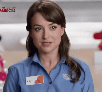 A Woman In A Blue Shirt Has A Name Tag That Says Lily GIF