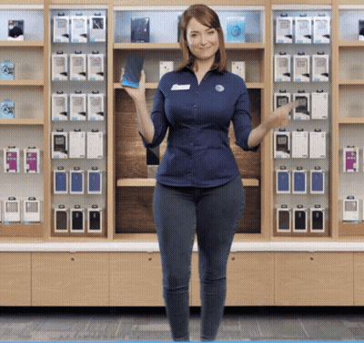 A Woman In A Blue Shirt Holds A Cell Phone GIF