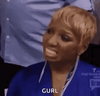 A Woman In A Blue Shirt Is Making A Funny Face With Her Tongue Out And The Word Curl Written On Her Face . GIF