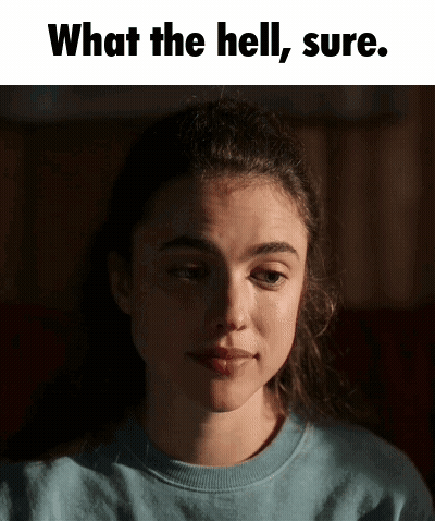 A Woman In A Blue Shirt Is Making A Funny Face With The Words " What The Hell Sure " Above Her GIF