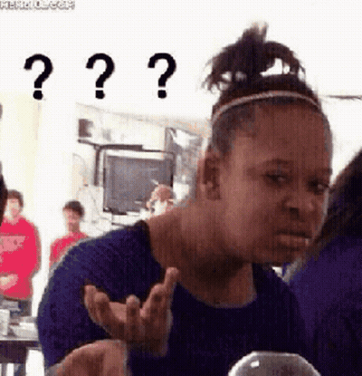 A Woman In A Blue Shirt Is Making A Funny Face With Three Question Marks . GIF
