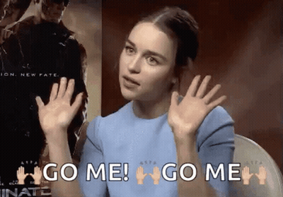 A Woman In A Blue Shirt Is Making A Gesture With Her Hands And Says `` Go Me ! '' GIF
