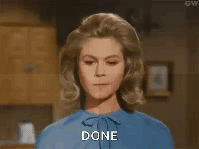 A Woman In A Blue Shirt Is Saying `` Done '' . GIF