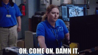 A Woman In A Blue Shirt Is Sitting In Front Of A Computer And Says `` Oh , Come On , Damn It . '' GIF
