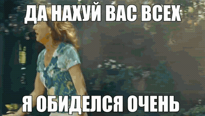 A Woman In A Blue Shirt Is Standing In Front Of A Sign That Says " Da Haxyu Bac Bcex " GIF