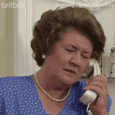 A Woman In A Blue Shirt Is Talking On A Phone With The Words Britbox Keeping Up Appearances Behind Her GIF