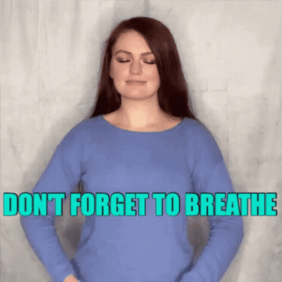 A Woman In A Blue Shirt Says " Don 'T Forget To Breathe " GIF