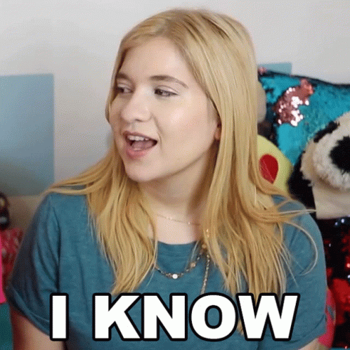 A Woman In A Blue Shirt Says " I Know " In White Letters GIF
