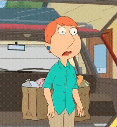 A Woman In A Blue Shirt Stands In Front Of A Car GIF