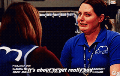 A Woman In A Blue Shirt That Says Clouds On It GIF