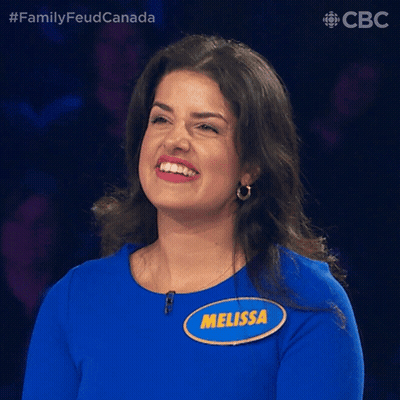 A Woman In A Blue Shirt With A Name Tag That Says Melissa GIF