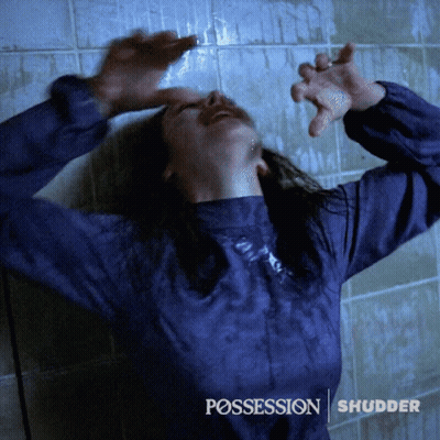 A Woman In A Blue Shirt With The Word Possession On The Bottom Right GIF