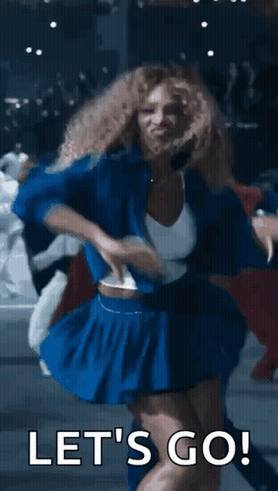 A Woman In A Blue Skirt Is Dancing With The Words `` Let 'S Go '' Behind Her . GIF