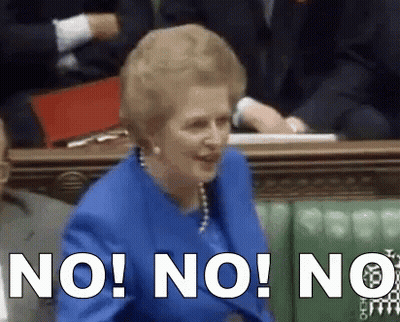 A Woman In A Blue Suit Is Sitting In A Parliament And Says " No " GIF